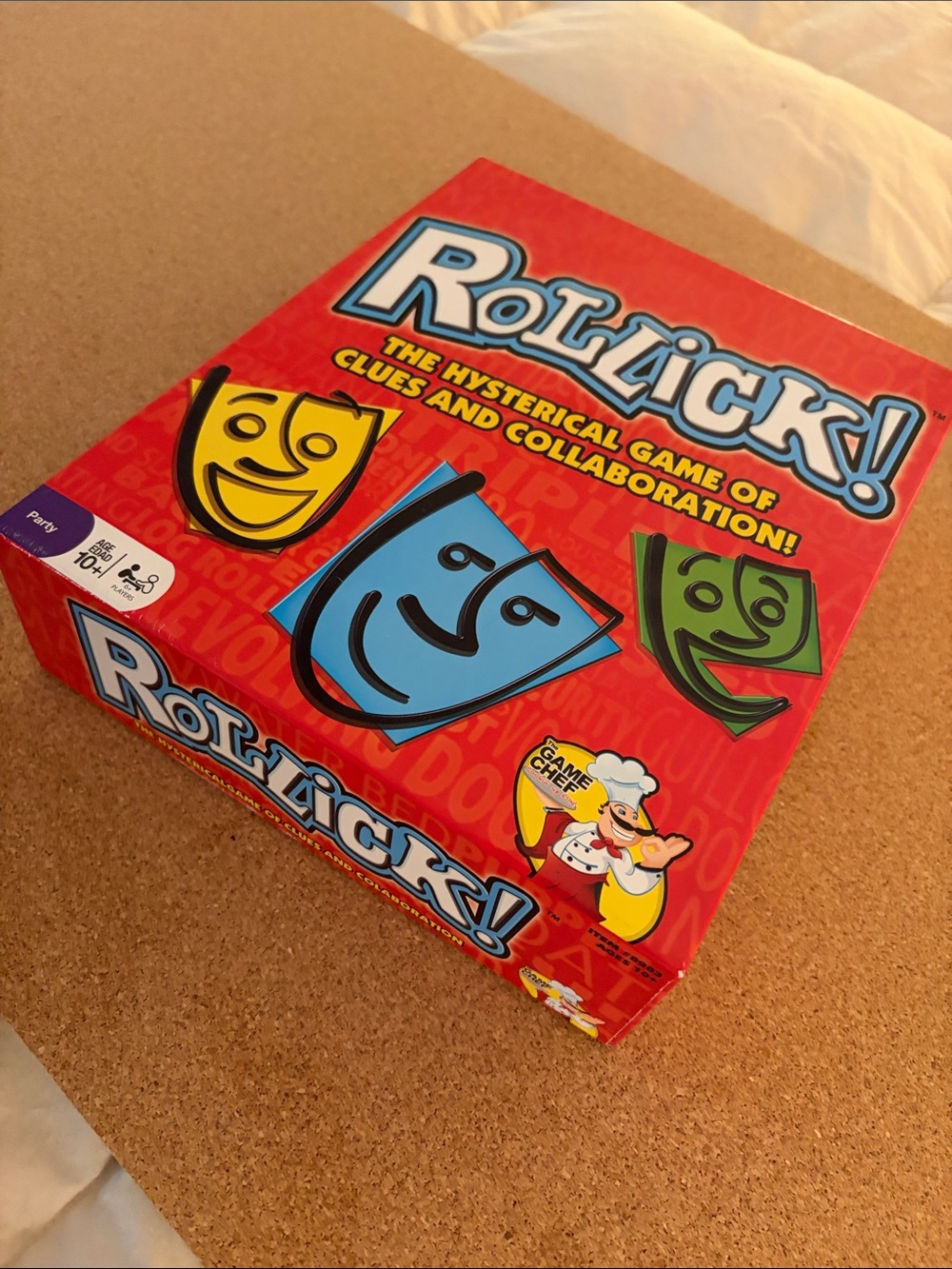 Rollick! Party Game by — Red Box with Blue, Yellow & Green Masks